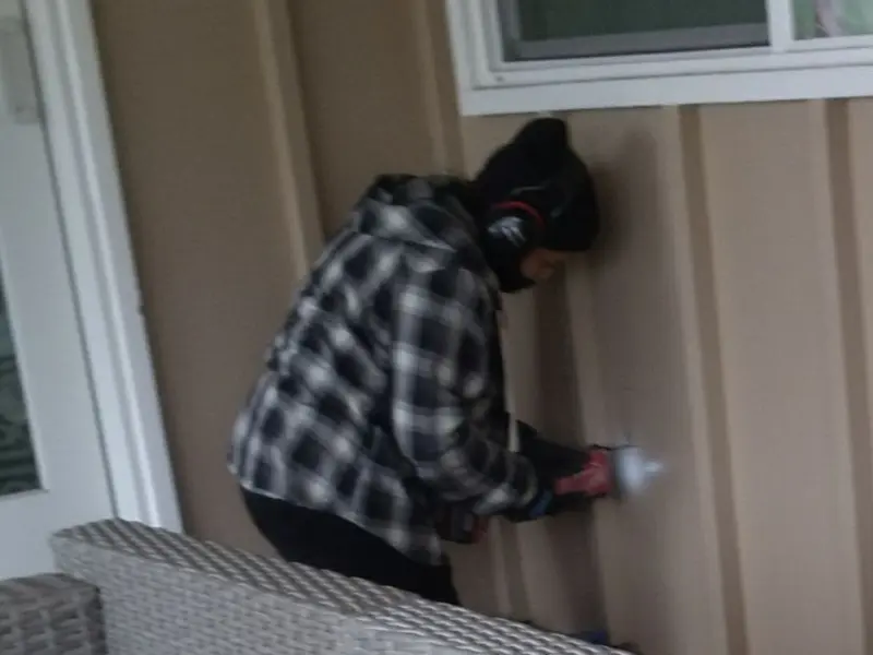 Professional electrician installing an exterior outlet in Pocola