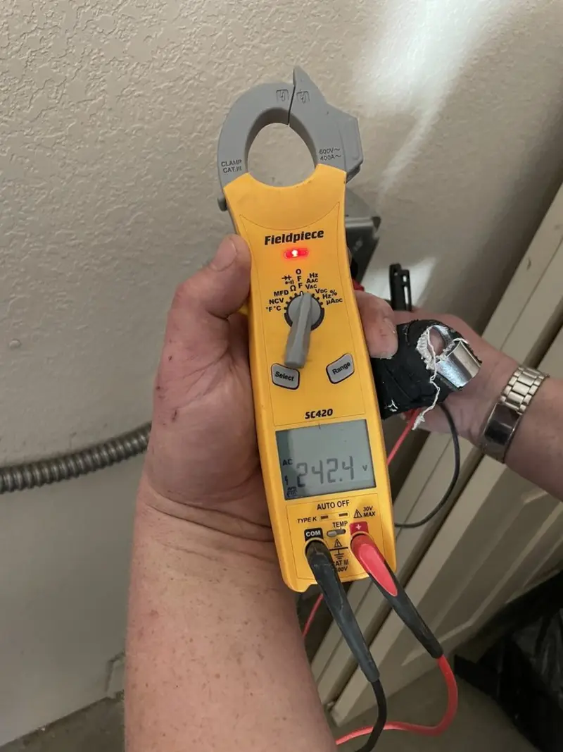 Voltage testing with clamp meter during Aluminum Wiring Replacement in Pocola